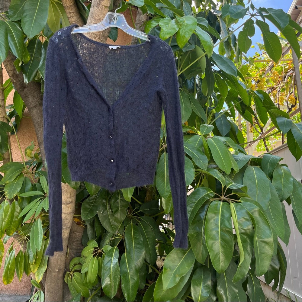 MANOUSH navy blue cardigan with intricate buttons.